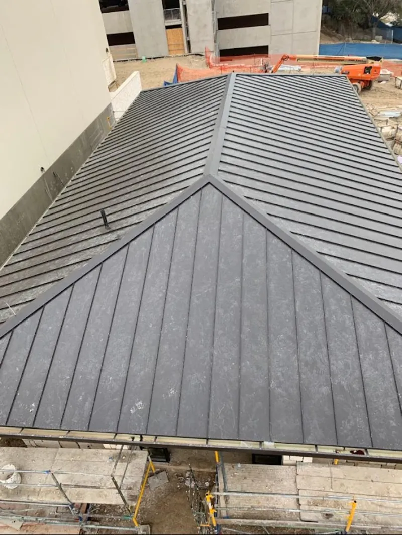 Commercial metal roof construction with crane equipment in Phillipsburg