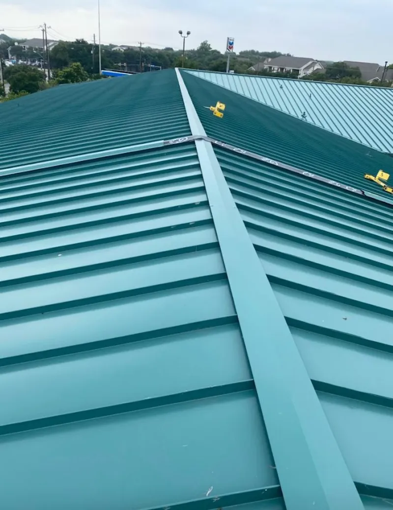 Green commercial metal roof ridge and valley for Metal Roof Repair in Phillipsburg